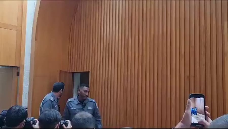 Yared enters the courtroom