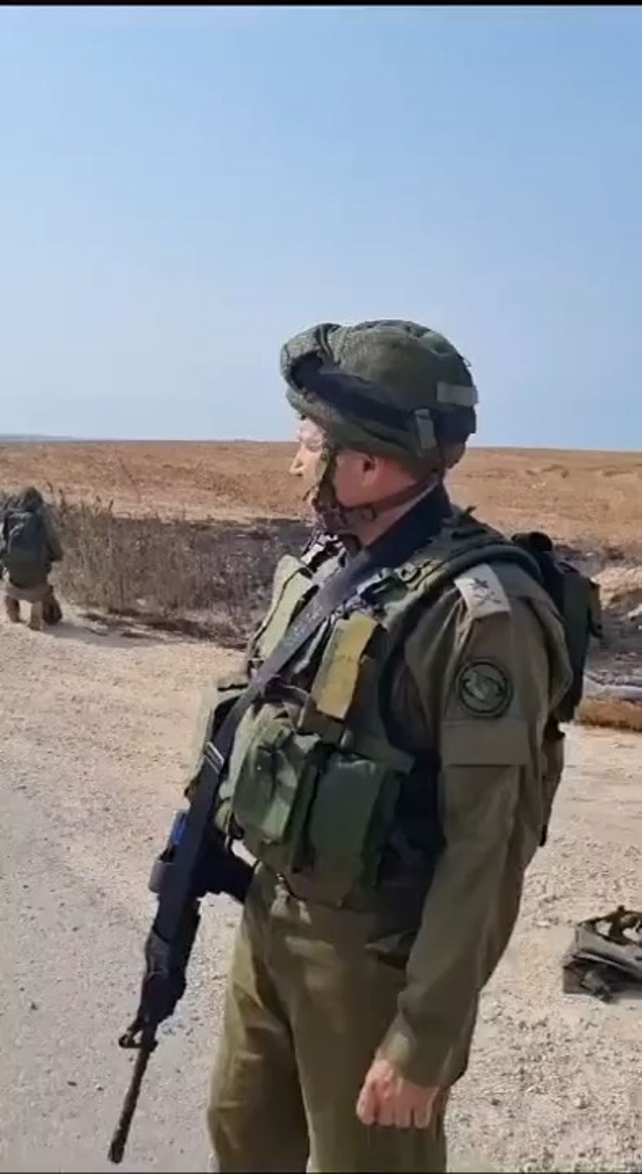 General David Zini in front of dozens of dead terrorists