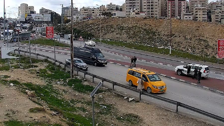 The terrorist just as he pulls the knife on the Border Guard.
