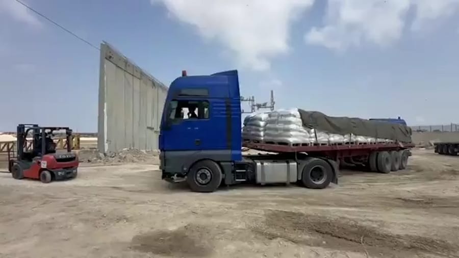 Trucks bringing in aid via Erez crossing.