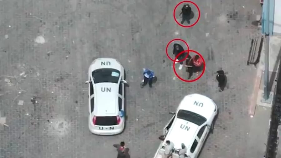 Hamas terrorists operating near UN vehicles and personnel.