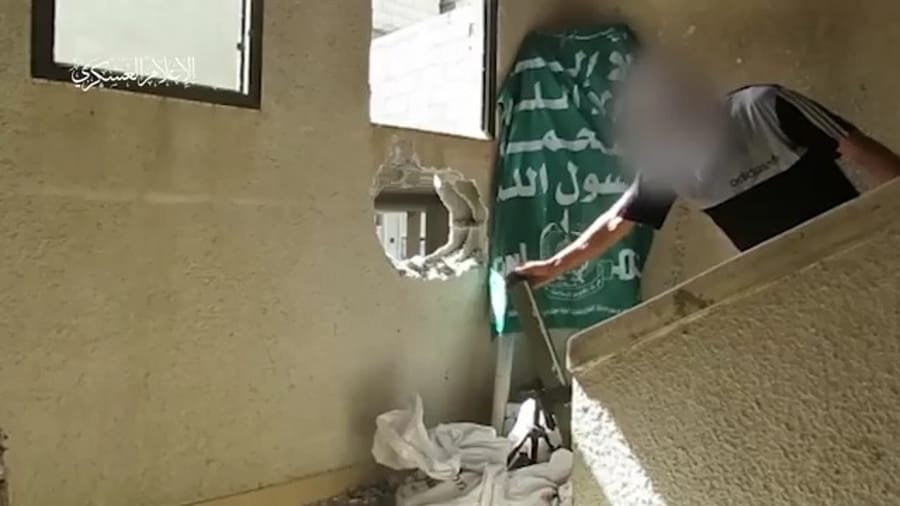 Hamas terrorist fighting in civilian garb.