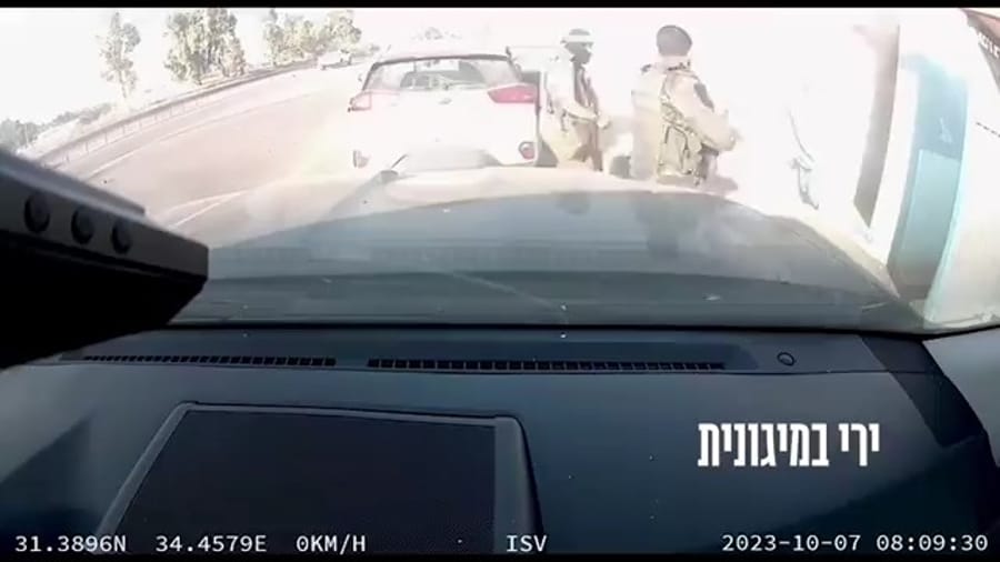 Hamas terrorists taking hostages on October 7.