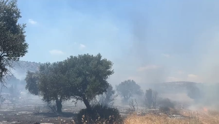 Putting out fires caused by Hezbollah rockets.