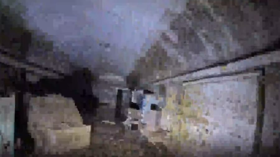 Documenting the terrorist weapons warehouse before demolition.