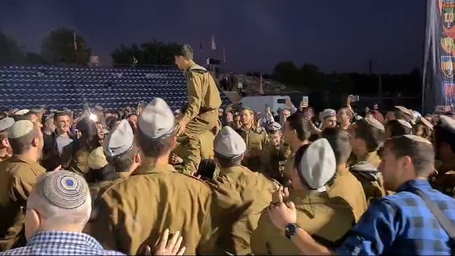 IDF combat soldiers cheer after finishing basic training