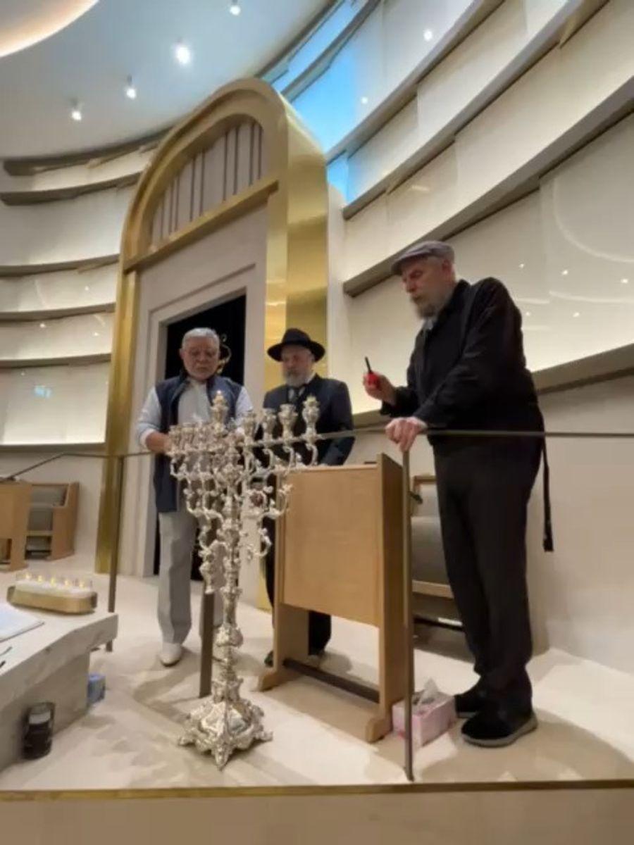 Lighting Hanukah candles