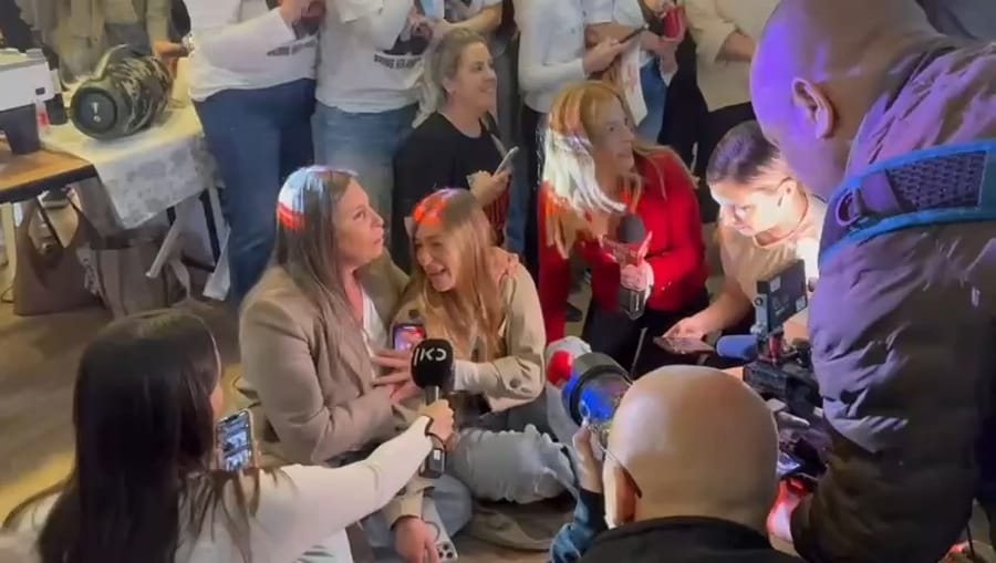 Agam Berger's family and friends wait for her release