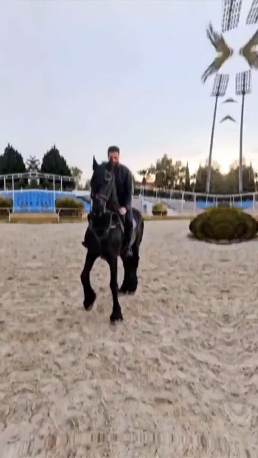 Syrian President riding a horse.