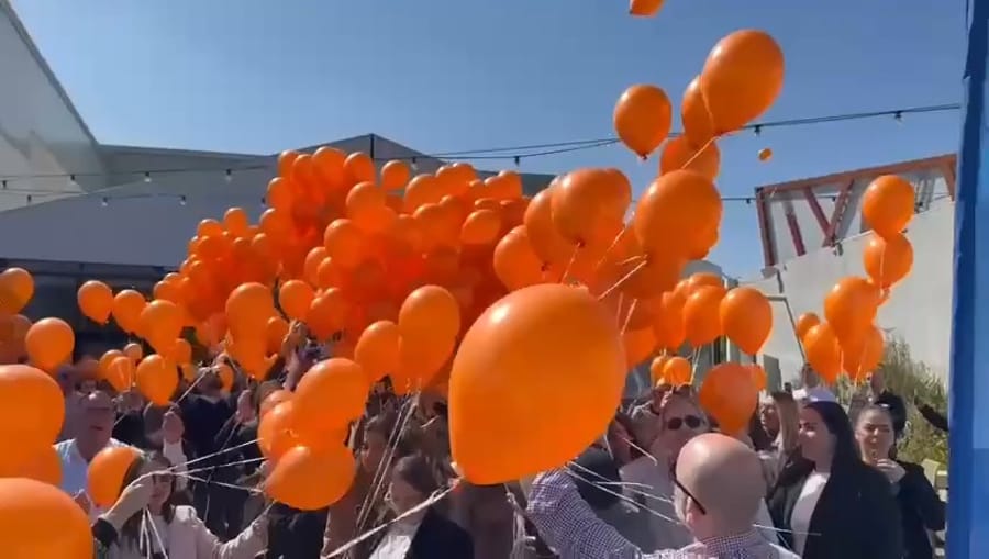 Assuta hospital release 510 orange balloons as Bibas family are laid to rest