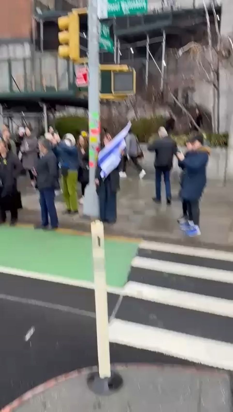 Israelis cheer for freed hostage Eli Sharabi, outside the UN