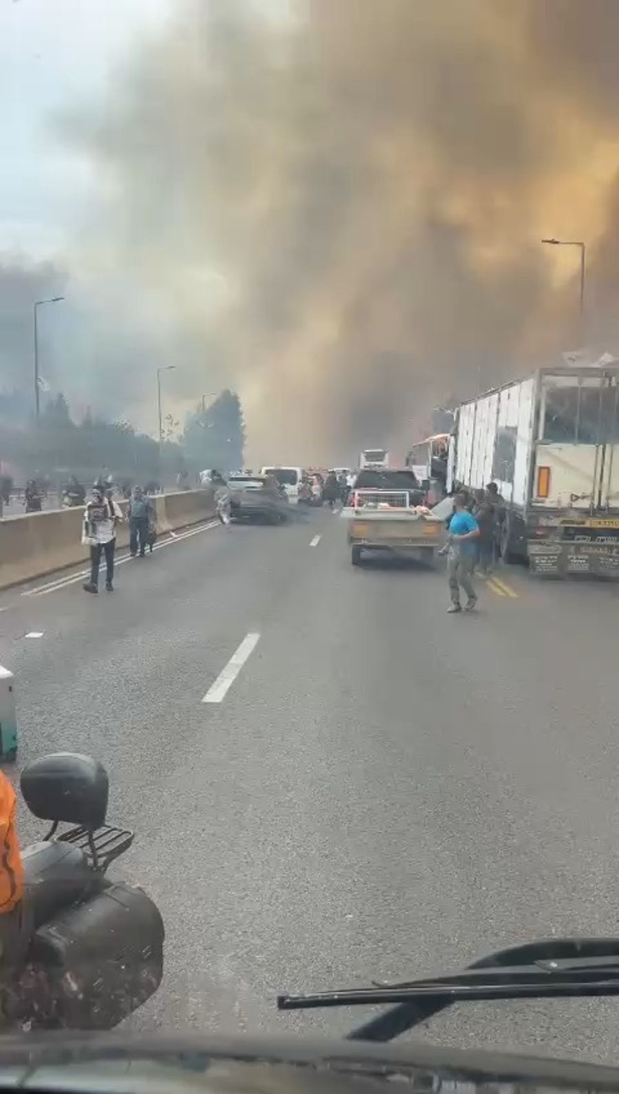 Civilians escaping as fires spread across Road 1 