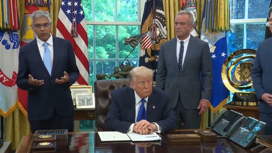 Donald Trump, flanked by Robert Kennedy and Jay Bhattacharya.
