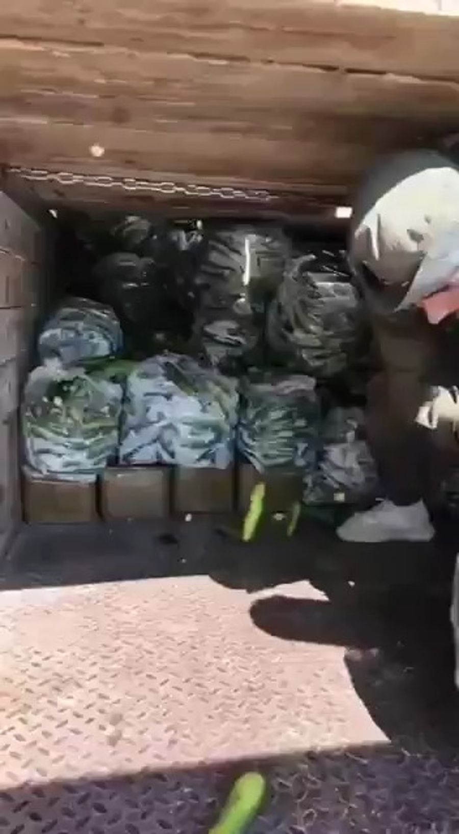Julani's forces seizing Hezbollah weapons.