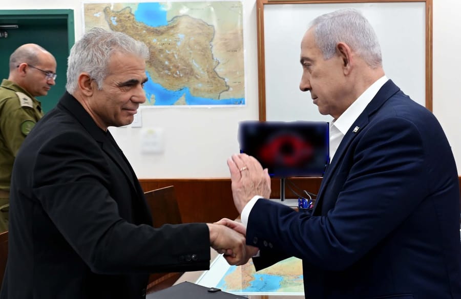 Netanyahu and Lapid Share Uncommon Handshake and Show of Unity Against Iran Threat