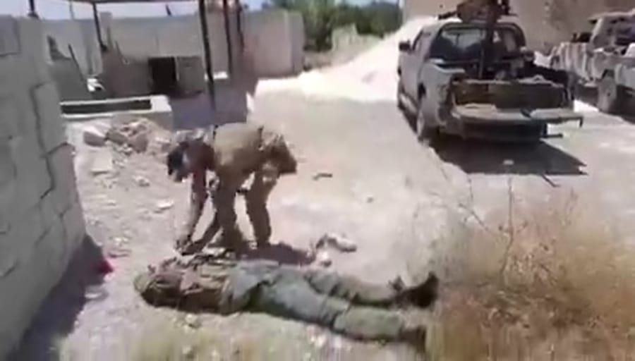 Al-Julani's men ripping mustaches off dead Druze man