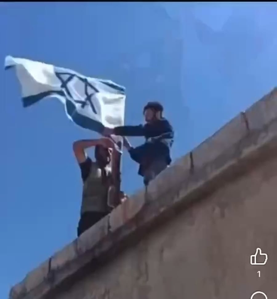 replacing them with Israeli flags