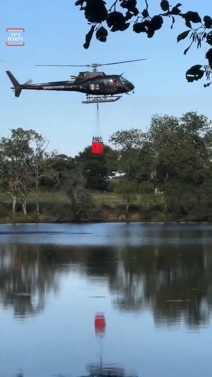 A firefighting helicopter in France crashed dramatically into a lake