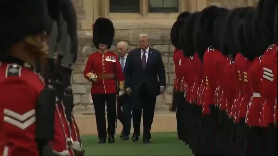 Donald Trump walks with King George III