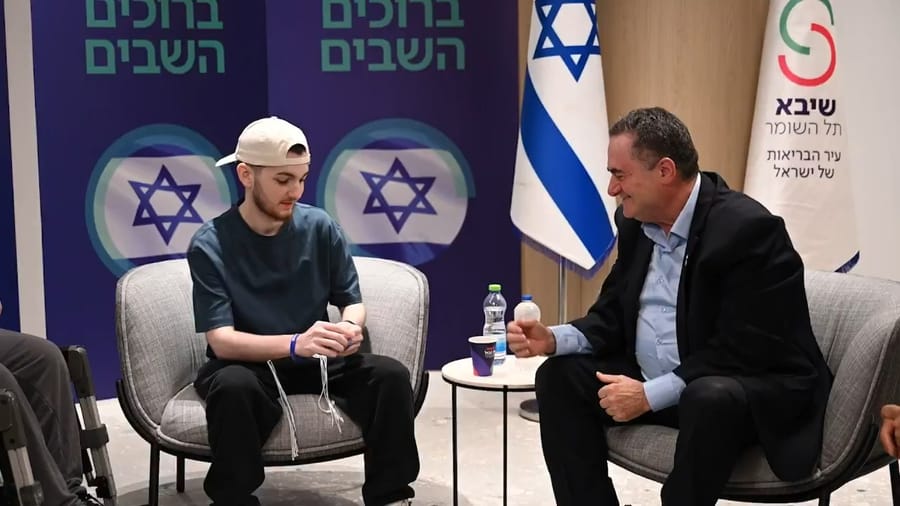 Defense Minister Israel Katz and fomer hostage Bar Kupershtein