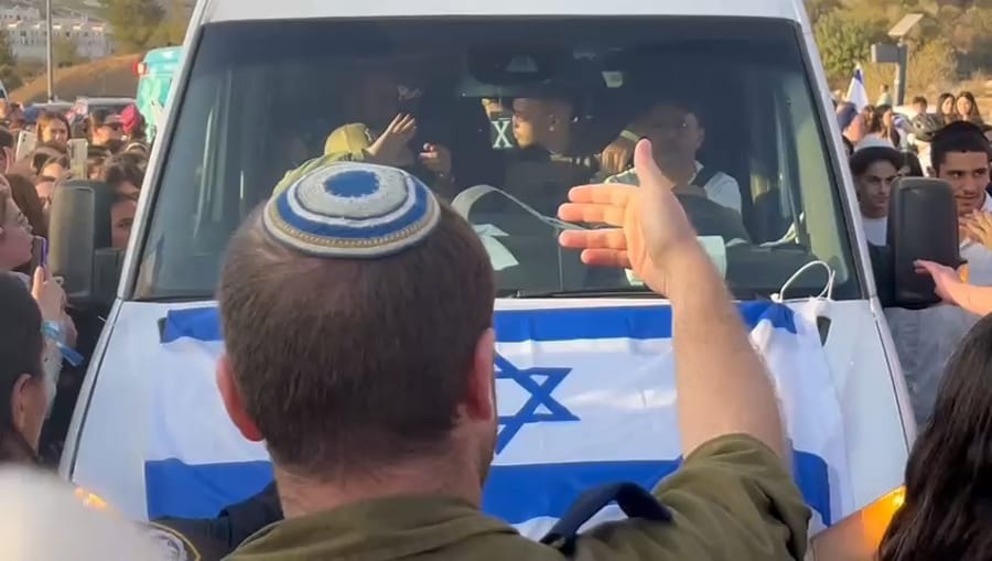 Hundreds line the streets to welcome Eitan Mor as he heads home