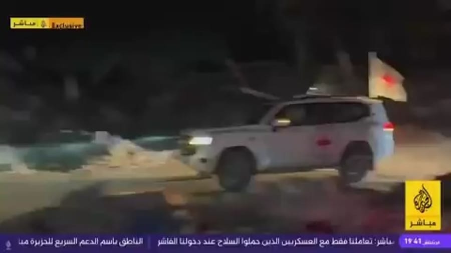 Remains of deceased hostage being handed to the Red Cross
