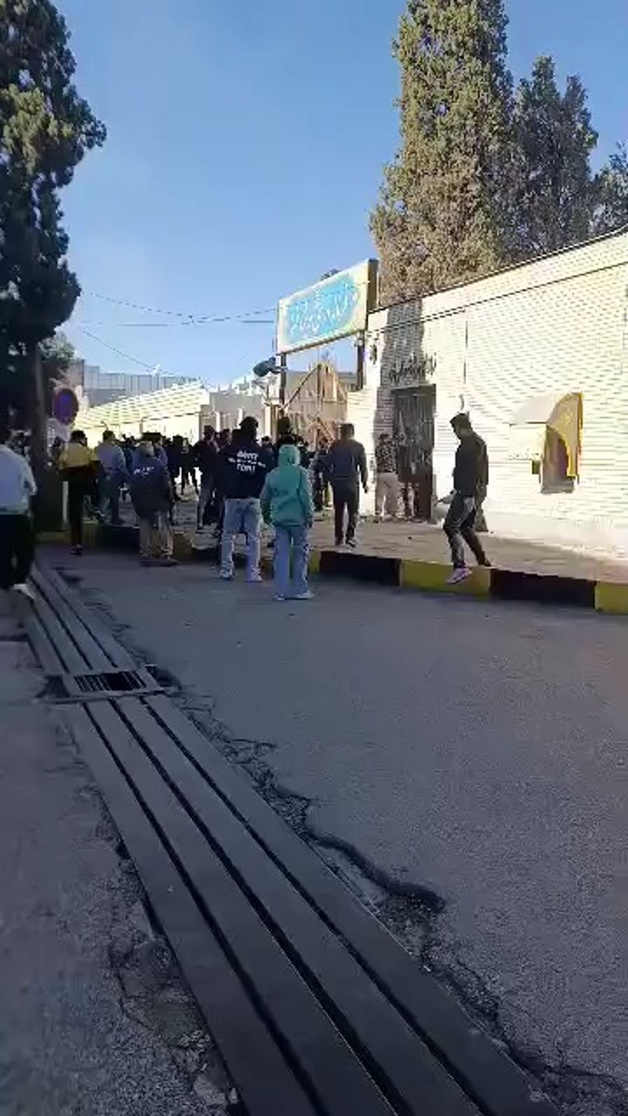 Protestors attacking a government building in Fasa.