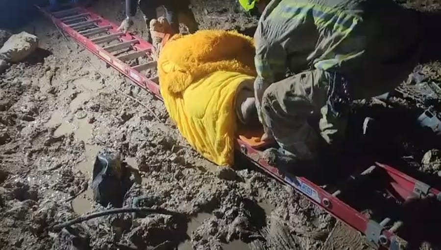 Search and rescue teams rescuing the teen from quicksand outside Jerusalem