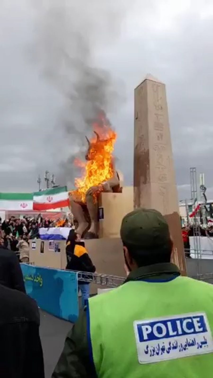 Iranian protesters set fire to an effigy labeled Baal,
