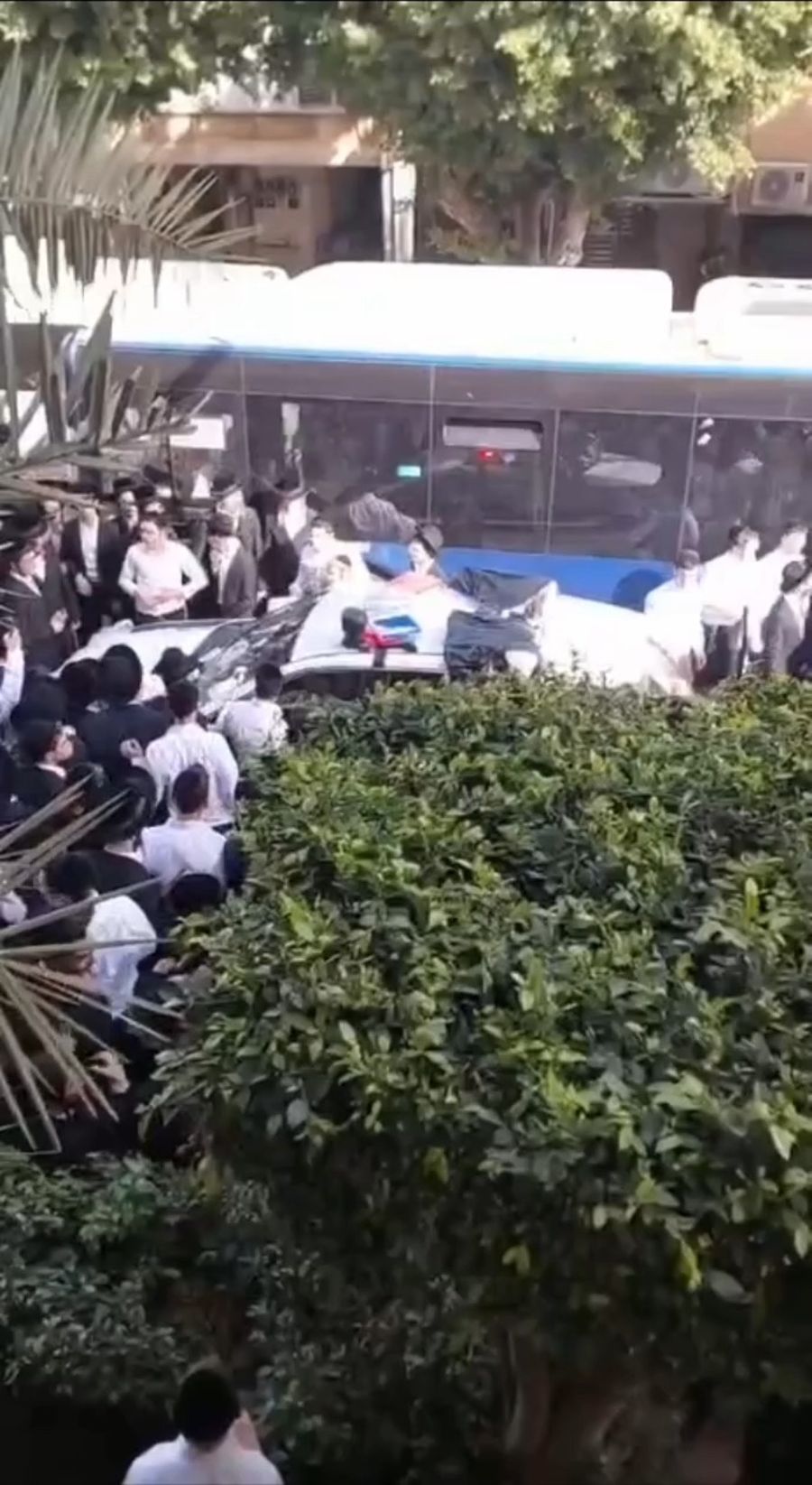 Haredi Rioters overturn police vehicle