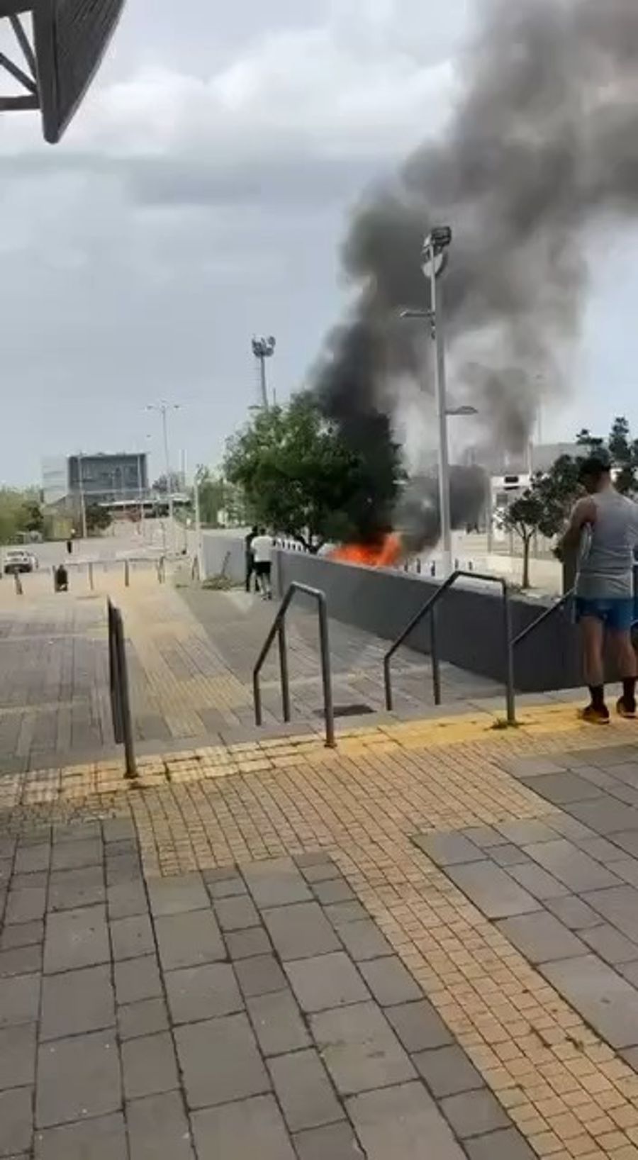 Car alight after Iranian barrage, March 18, 2026