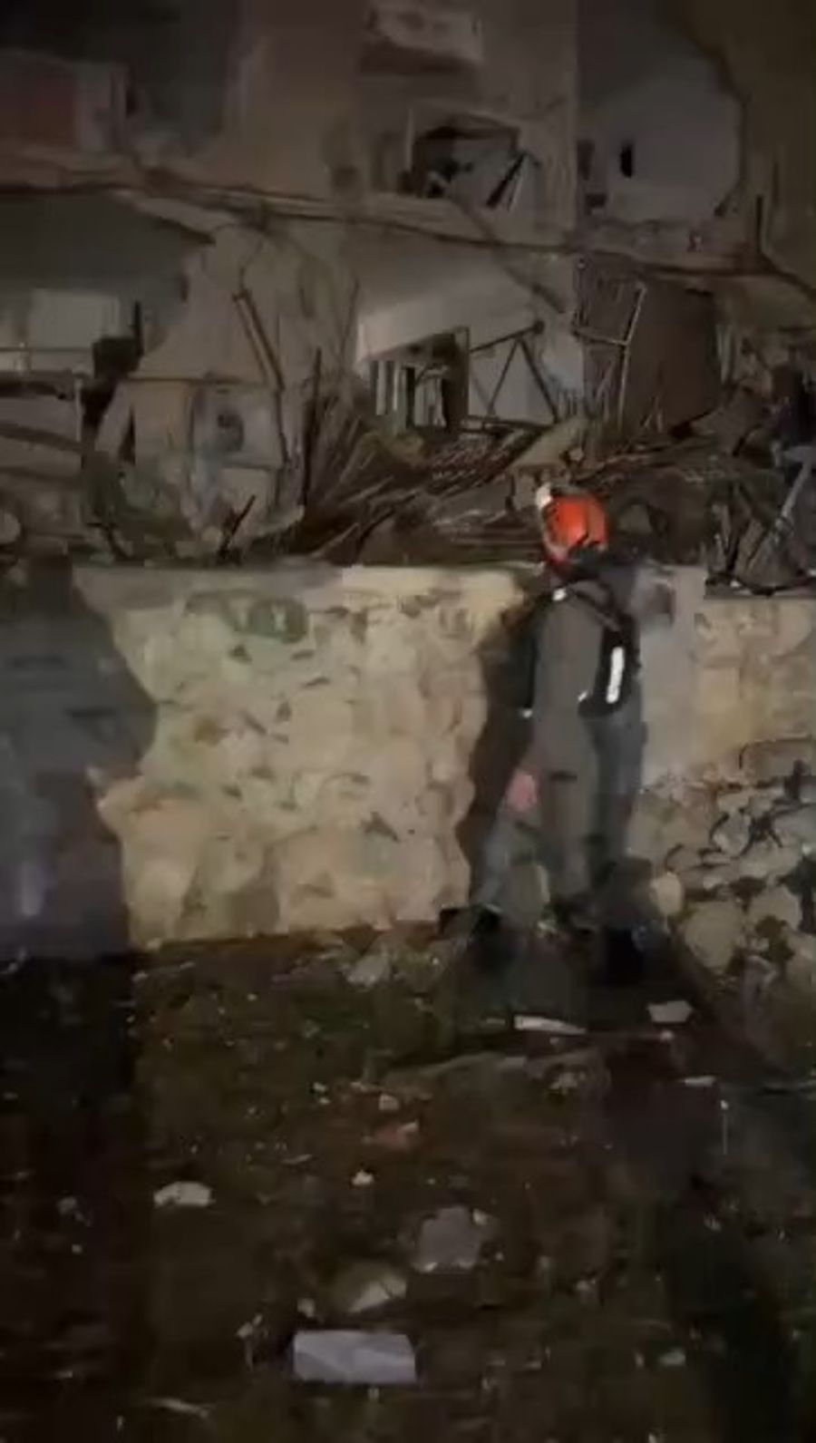 Firemen call out to residents after Iranian ballistic missile strikes Dimona
