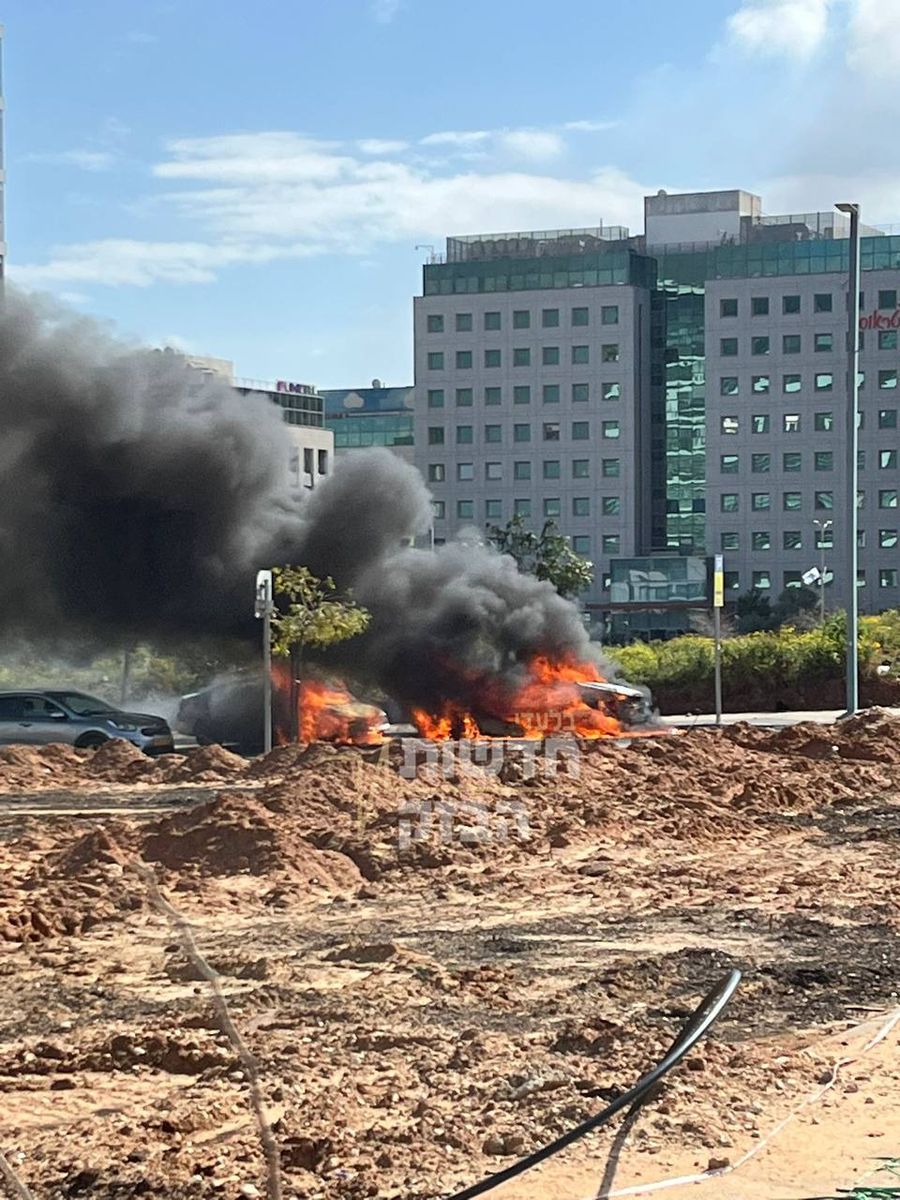 Cars alight in Givat Shmuel after Iranian attack