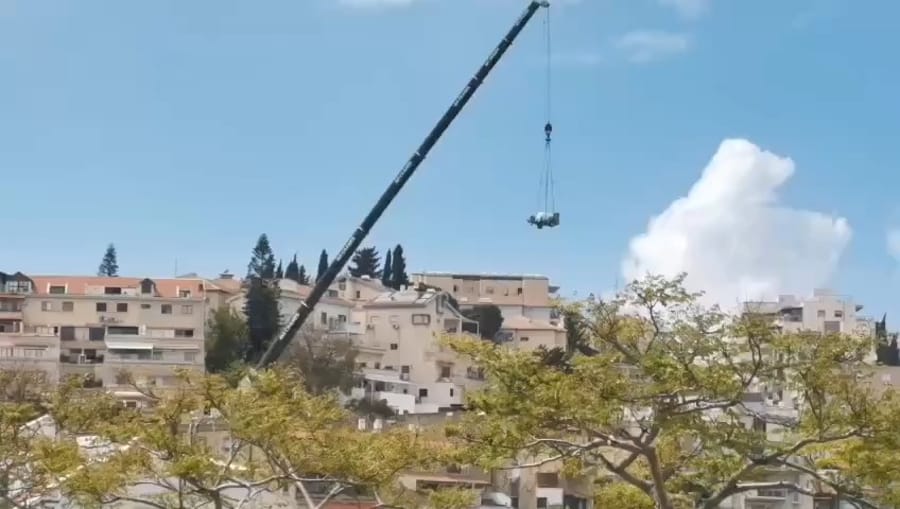 Missile being extracted from the site in Haifa