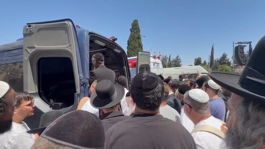 Mourners at Shalom Saginer's funeral