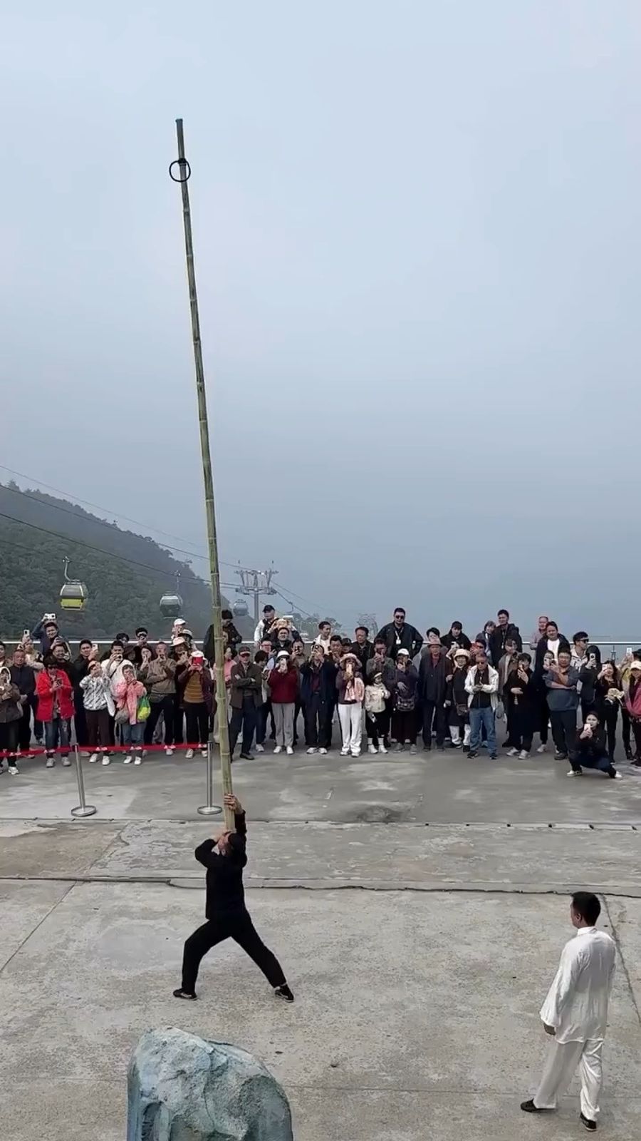 Acrobat Balancing A Stunt Man On a 6-Meter-Long Bamboo