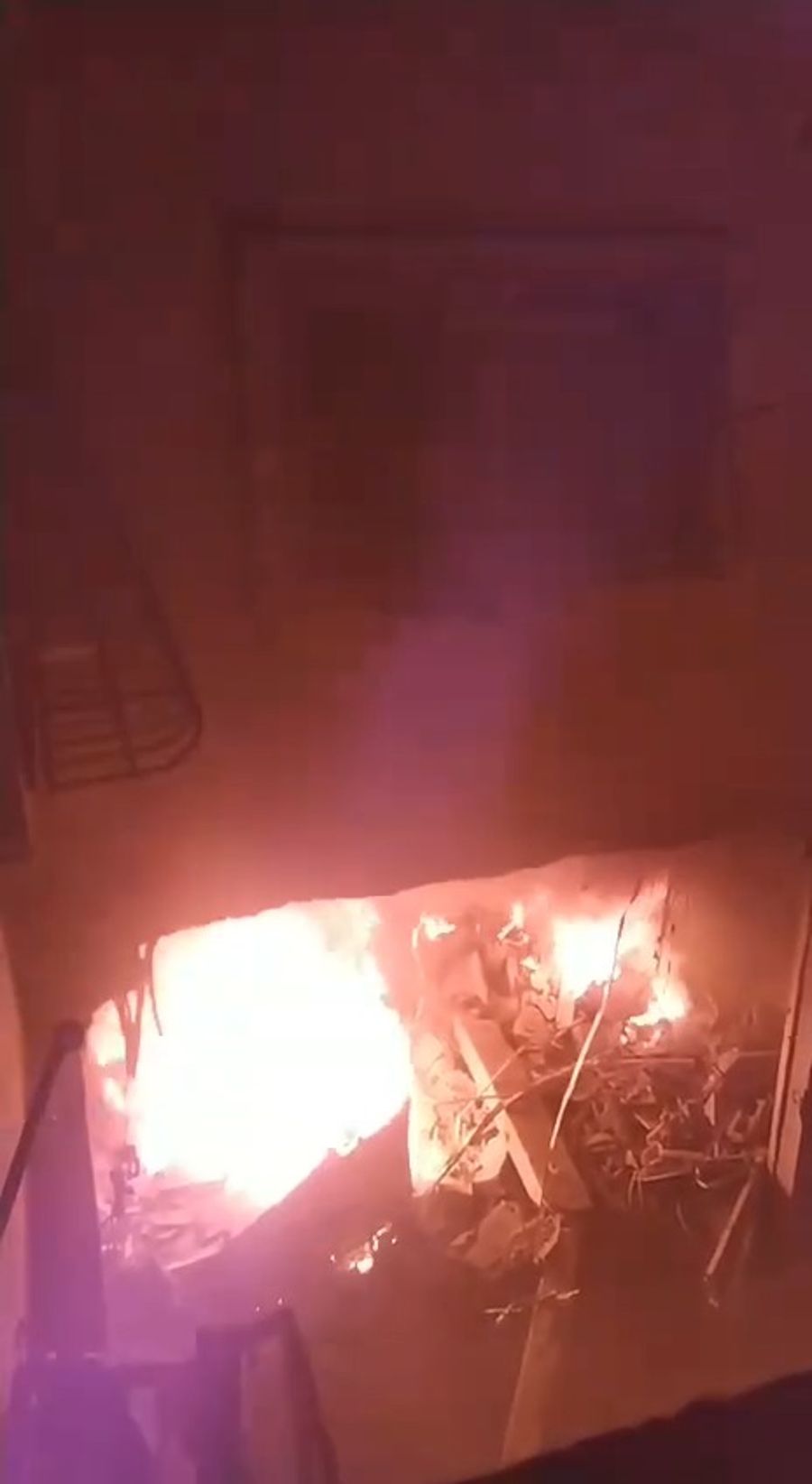 The apartment on fire after the strike
