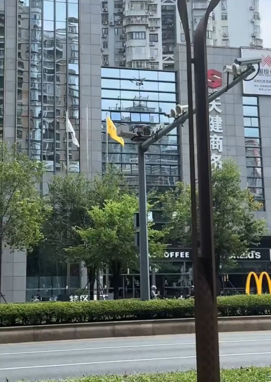Drivers stopped to photograph the drone docking stations China installed above traffic lights