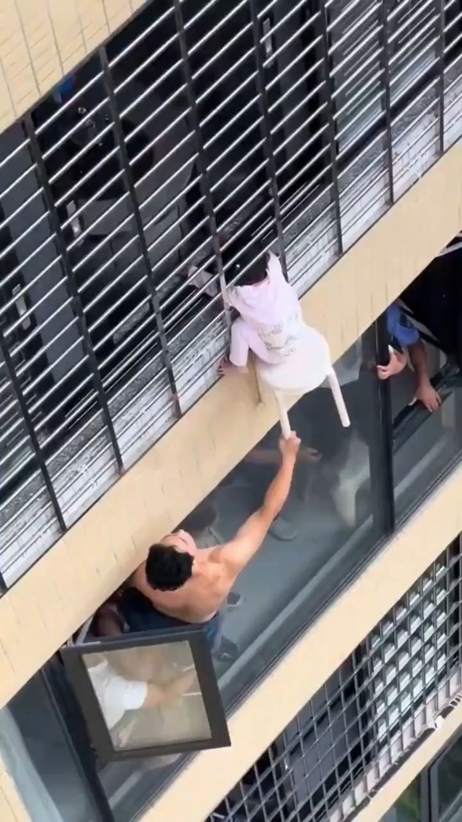Toddler found dangling from 12th-floor window in China