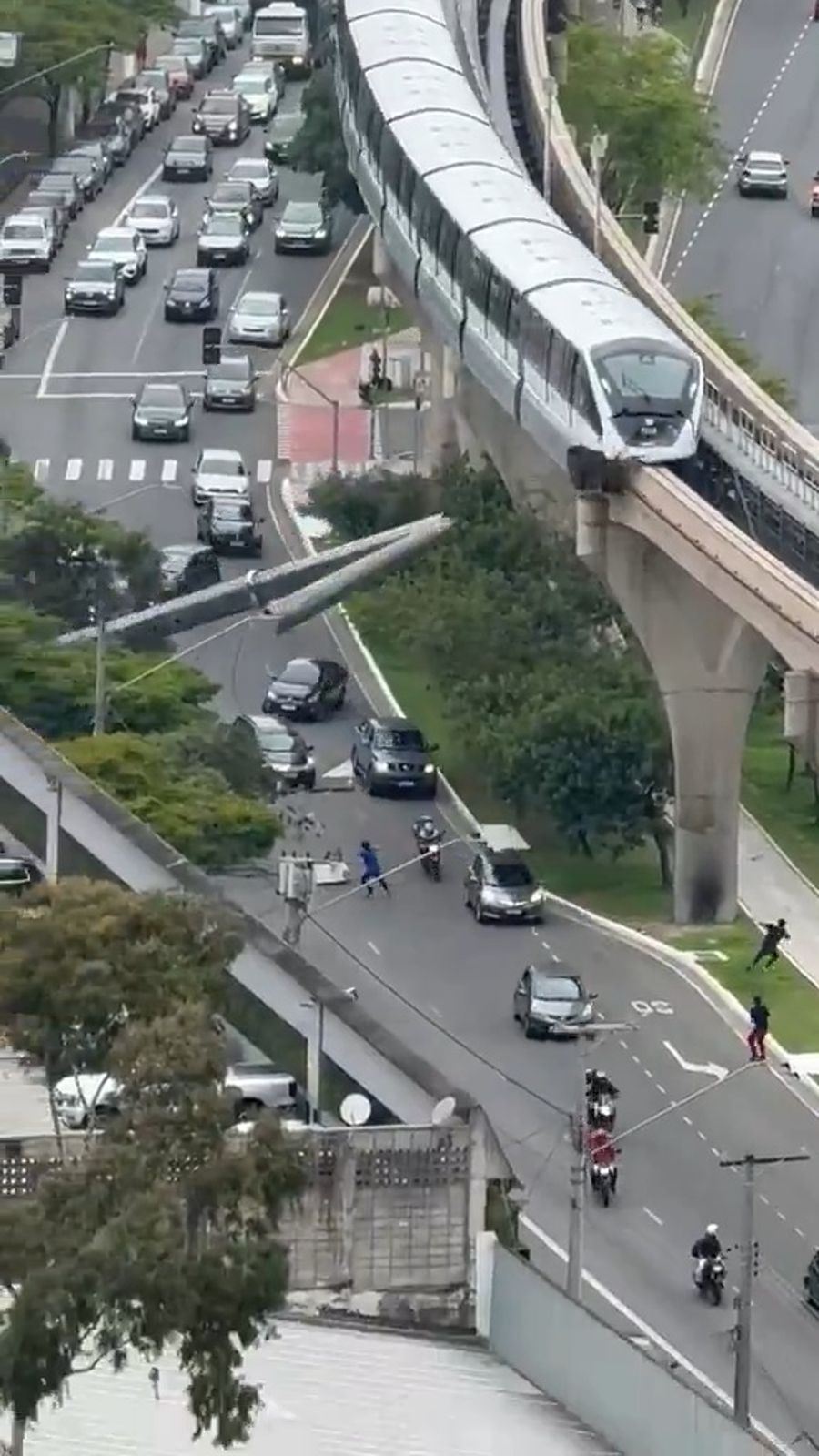 Train smashes crane that collapsed onto elevated tracks in São Paulo