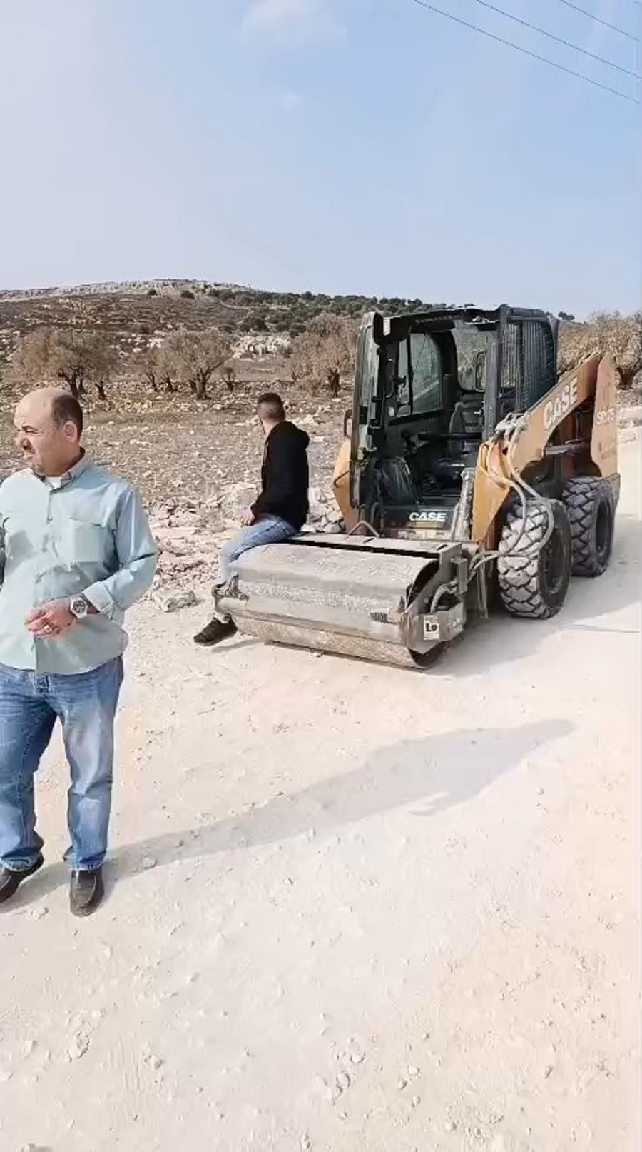 Arab workers attempting to carve the road