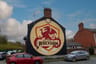 Wrexham, Wales - A "Welcome to Wrexham" mural on the exterior wall of a row of houses,