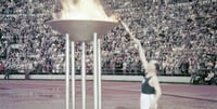 Paavo Nurmi lights the Olympic torch