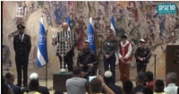 Knesset Chairman Amir Ohana lights the menorah on the eighth night of Hannukah.