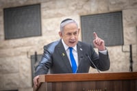 Israeli Prime Minister Binyamin Netanyahu attends a state memorial ceremony for victims of terror, at Mount Herzl military cemetery in Jerusalem, May 13, 2024, during Memorial Day which commemorates the fallen Israeli soldiers and victims of terror. 