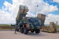  Patriot Guided Missile System and Iron Dome launcher at the exhibition 