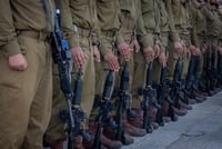 Israeli soldiers from Netzah Yeh attend a swearing-in ceremony at the Western Wall in Jerusalem's Old City, on July 10, 2024