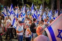 Thousands anti-overhaul activists march through Tel Aviv as they protest the government's judicial reform 