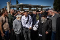 Friends and family attend the funeral of Rabbi Yitzhak Zeiger, killed in a terror attack near Eli, March 1, 2024 