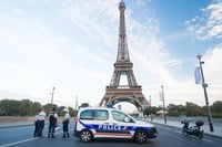 Paris, France: Police checkpoint on Eiffel tower background